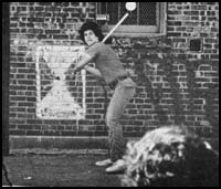Boy at bat playing fast-pitch stickball