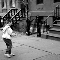 Boy plays stoopball