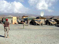 American troops playing stickball in Afghanistan